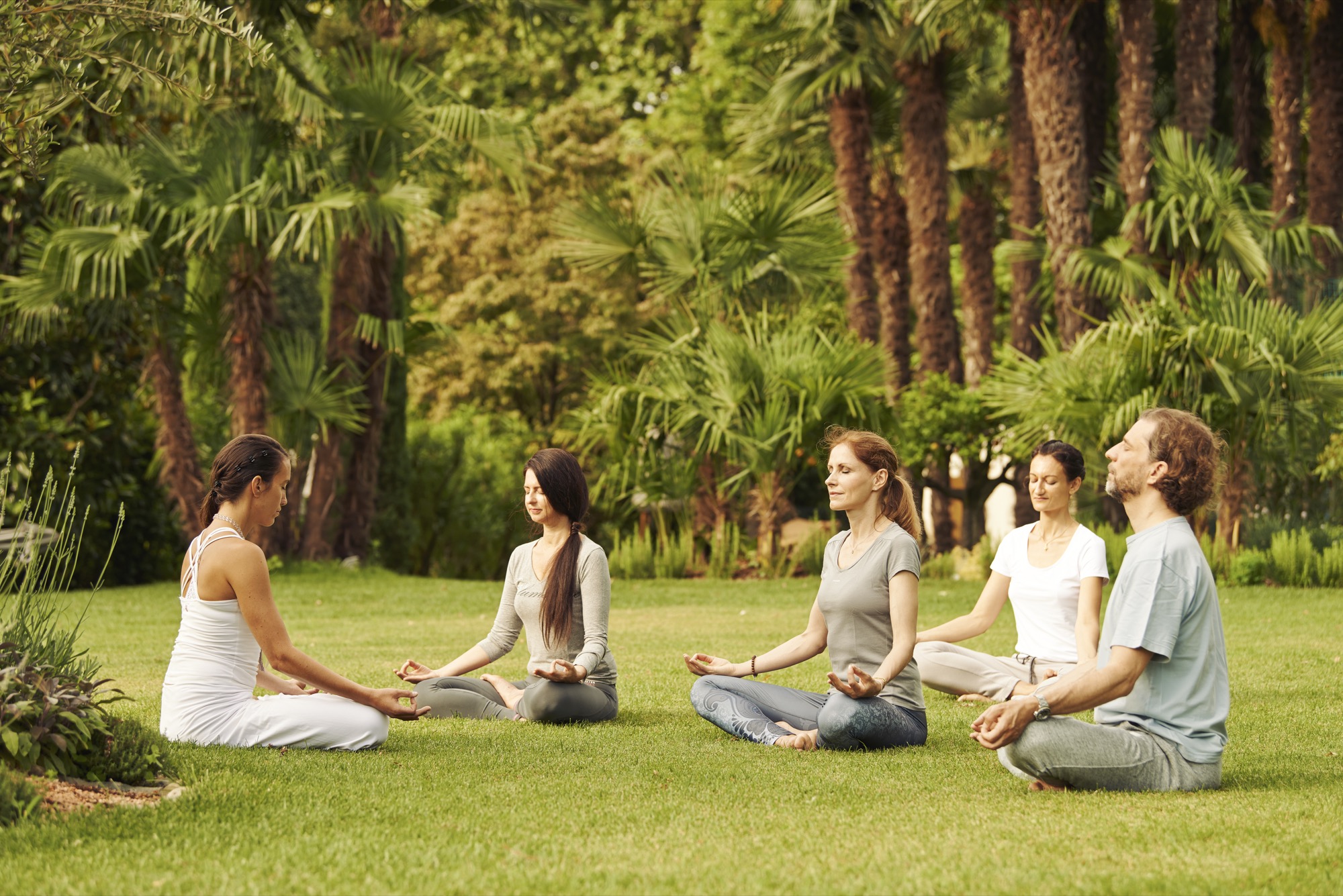 Yoga session in the garden of Giardino Ascona