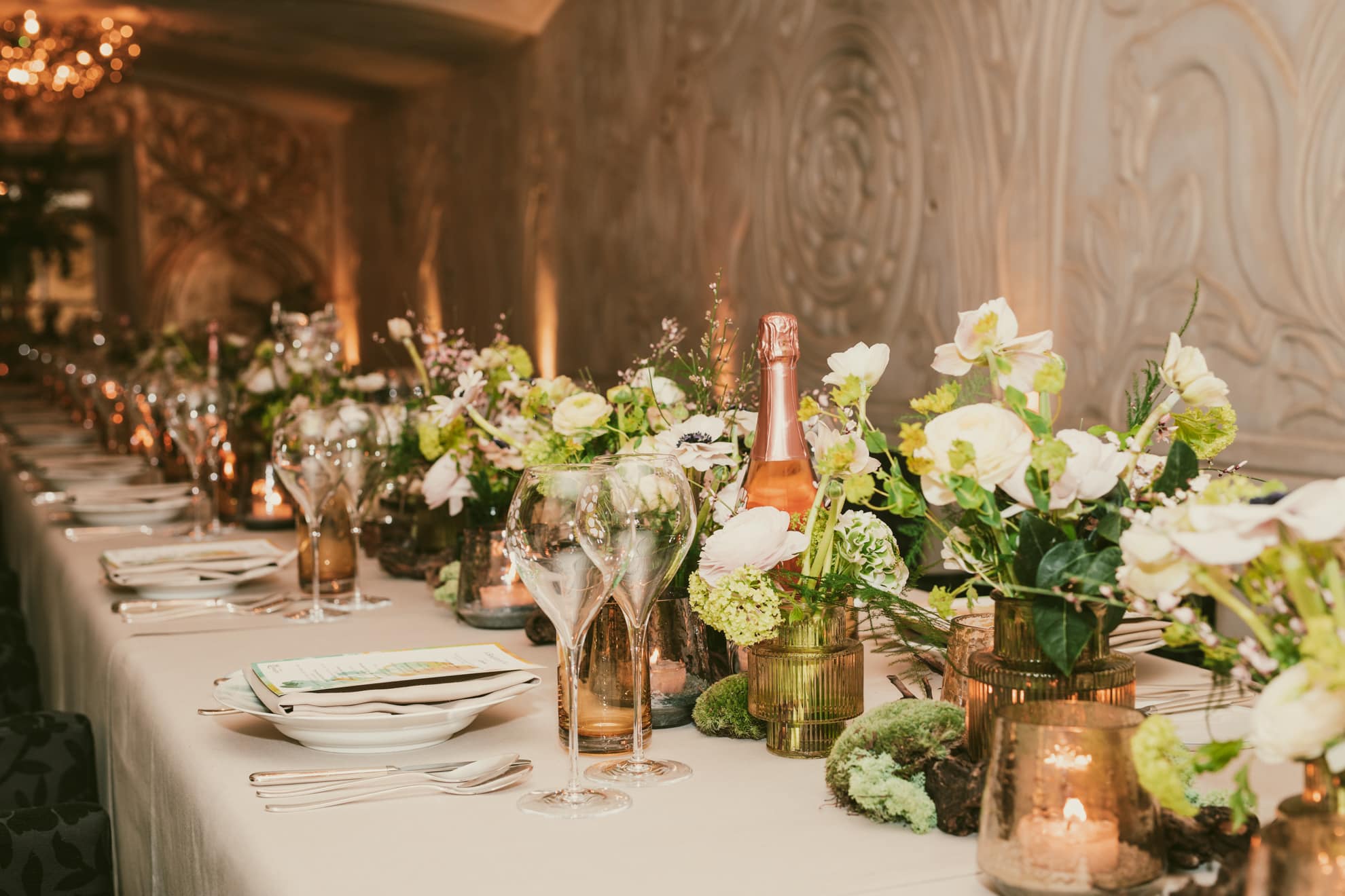 Events 6 a table set with wine glasses and flowers